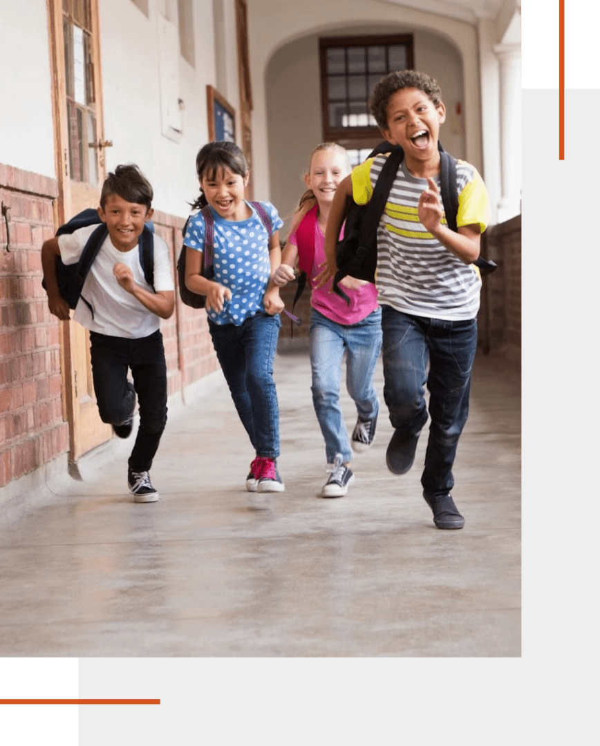 Group 1321314601 Children running joyfully in school corridor.